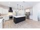 Modern kitchen with white cabinets, quartz countertops, and stainless steel appliances at 706 S Main St, Whitestown, IN 46075