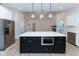 Large kitchen island with quartz countertop and built-in microwave at 706 S Main St, Whitestown, IN 46075