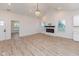 Spacious living room with hardwood floors and electric fireplace at 706 S Main St, Whitestown, IN 46075
