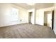 Bright bedroom with neutral carpet, window, and closet at 3442 N Capitol Ave, Indianapolis, IN 46208