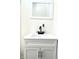 White bathroom vanity with a modern black faucet and mirror at 3442 N Capitol Ave, Indianapolis, IN 46208