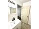 Bathroom with white vanity, shower, and beige tile floor at 3442 N Capitol Ave, Indianapolis, IN 46208