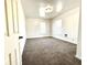 Spacious bedroom with neutral-toned carpet and two windows at 3442 N Capitol Ave, Indianapolis, IN 46208
