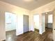 Bright hallway with doors leading to bedrooms and bathroom at 3442 N Capitol Ave, Indianapolis, IN 46208