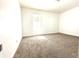Simple bedroom with carpeted floor and a window providing natural light at 3442 N Capitol Ave, Indianapolis, IN 46208