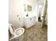 Clean bathroom featuring a white vanity, toilet, and tiled floor at 3442 N Capitol Ave, Indianapolis, IN 46208