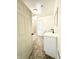 Modern bathroom with white vanity, bathtub and tiled floor at 3442 N Capitol Ave, Indianapolis, IN 46208