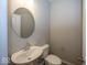 Convenient powder room with pedestal sink and toilet at 3979 Willow Branch Way, Westfield, IN 46062