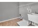 Laundry room with utility sink and overhead shelving at 7054 Lavender Ct, Indianapolis, IN 46237