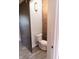 Small bathroom with toilet and exposed brick wall at 610 N Park Ave, Indianapolis, IN 46204