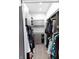Spacious walk-in closet with custom built-in shelving and hanging rods at 610 N Park Ave, Indianapolis, IN 46204