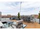 Spacious rooftop deck with city views, comfortable seating, and string lights at 610 N Park Ave, Indianapolis, IN 46204