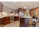 Modern kitchen featuring stainless steel appliances, a large island, and ample cabinet space at 610 N Park Ave, Indianapolis, IN 46204