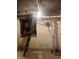 Unfinished basement with exposed mechanicals and ladder access at 610 N Park Ave, Indianapolis, IN 46204