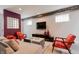 Bright living room featuring comfortable seating, a large TV, and stylish decor at 610 N Park Ave, Indianapolis, IN 46204