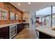 Modern kitchen with dark wood cabinets, wine cooler, and marble countertops at 610 N Park Ave, Indianapolis, IN 46204