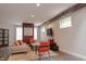 Open concept living space with hardwood floors, modern furniture, and exposed ductwork at 610 N Park Ave, Indianapolis, IN 46204