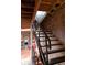 Modern metal staircase with glass railings leading to an upper level at 610 N Park Ave, Indianapolis, IN 46204