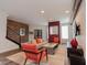 Spacious living area with exposed brick wall, comfortable seating, and a modern aesthetic at 610 N Park Ave, Indianapolis, IN 46204