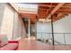 Open loft area with exposed brick, hardwood floors, and a modern metal staircase at 610 N Park Ave, Indianapolis, IN 46204