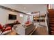 Open living area showcasing a contemporary design, hardwood floors, and a view of the kitchen at 610 N Park Ave, Indianapolis, IN 46204