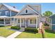 Charming craftsman style home with a welcoming front porch and landscaped yard at 805 Iowa St, Indianapolis, IN 46203