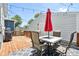 Relax and entertain on this inviting deck featuring a dining area, string lights, and grill at 805 Iowa St, Indianapolis, IN 46203