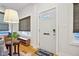 Light and airy entryway with hardwood floors and a stylish door at 805 Iowa St, Indianapolis, IN 46203
