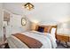 Bedroom with double bed, wooden nightstands, and closet at 805 Iowa St, Indianapolis, IN 46203