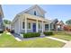 Two-story gray house with a blue door and a walkway to the porch at 805 Iowa St, Indianapolis, IN 46203