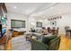Bright living room features hardwood floors, comfortable seating, and a large TV at 805 Iowa St, Indianapolis, IN 46203