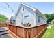 This deck offers a relaxing space with a patio set and string lights at 805 Iowa St, Indianapolis, IN 46203