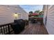 This backyard deck features a grill, string lights, and a dining area, ideal for outdoor entertaining at 805 Iowa St, Indianapolis, IN 46203