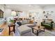 Bright and airy living room with sectional sofa and view into dining area at 805 Iowa St, Indianapolis, IN 46203