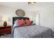 Main bedroom with a dark grey headboard, and orange pillows at 805 Iowa St, Indianapolis, IN 46203
