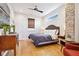 Main bedroom with hardwood floors and a ceiling fan at 805 Iowa St, Indianapolis, IN 46203
