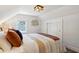 Bedroom with double bed, window, and sliding door closet at 805 Iowa St, Indianapolis, IN 46203
