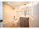 Clean bathroom with tub, toilet and vanity with wood cabinets at 7936 Beaumont Green Pl, Indianapolis, IN 46250