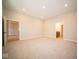 Spacious carpeted bedroom with an ensuite bathroom and access to another room at 7936 Beaumont Green Pl, Indianapolis, IN 46250