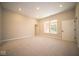 Bright bonus room with carpeted floors and access to a bathroom at 7936 Beaumont Green Pl, Indianapolis, IN 46250