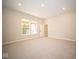 Spacious bonus room with carpeted floors and natural light at 7936 Beaumont Green Pl, Indianapolis, IN 46250