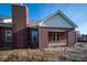 Brick house with a covered patio and a chimney at 7936 Beaumont Green Pl, Indianapolis, IN 46250