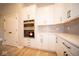 White kitchen cabinets with stainless steel appliances at 7936 Beaumont Green Pl, Indianapolis, IN 46250