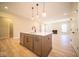 Modern kitchen island with quartz countertops and stainless steel appliances at 7936 Beaumont Green Pl, Indianapolis, IN 46250