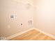 Laundry room with shelving and hookups for a washer and dryer at 7936 Beaumont Green Pl, Indianapolis, IN 46250