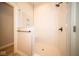 Walk-in shower with marble tile and built-in shelving at 7936 Beaumont Green Pl, Indianapolis, IN 46250