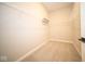 Large walk-in closet with wire shelving; ample storage space at 7936 Beaumont Green Pl, Indianapolis, IN 46250