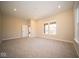 Bright basement room featuring neutral walls and carpeted floor at 7942 Beaumont Green Pl, Indianapolis, IN 46250