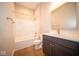 Modern bathroom with a large shower/tub combo and dark vanity at 7942 Beaumont Green Pl, Indianapolis, IN 46250