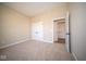 Well-lit bedroom with neutral carpeting and double door closet at 7942 Beaumont Green Pl, Indianapolis, IN 46250